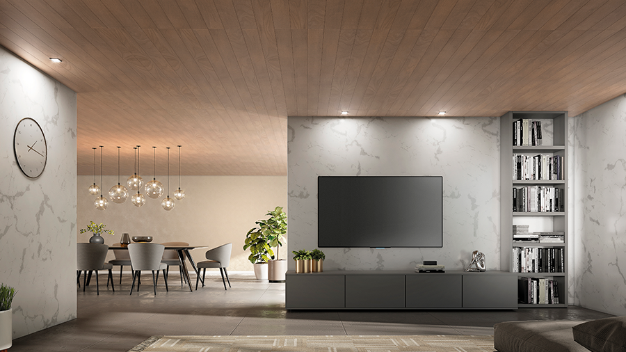 Fotografia de um espaço residencial interno com revestimento de parede e teto de madeira, piso de madeira, estante, sofás, móveis e objetos de decoração.