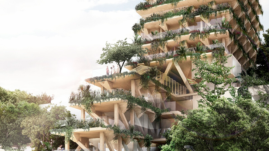 Imagem de um prédio aberto com estrutura de madeira rodeado de plantas e árvores de frente para uma rua com pessoas andando.